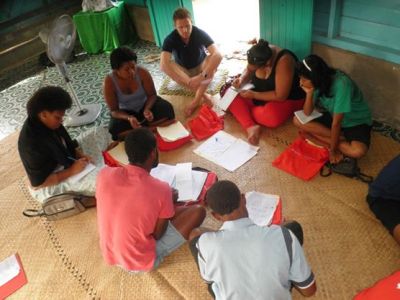Image: Aidan Craney with Fijian youths during microenterprise training.