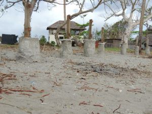 Credit: T. Brimacombe Image: Concrete foundations indicate the previous sand level at Mele Beach, where sea surges eroded the surrounding areas (Credit: T. Brimacombe)